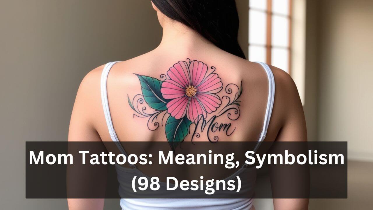 A vibrant pink daisy tattoo with swirling leaves and elegant Mom script on a woman's upper back.