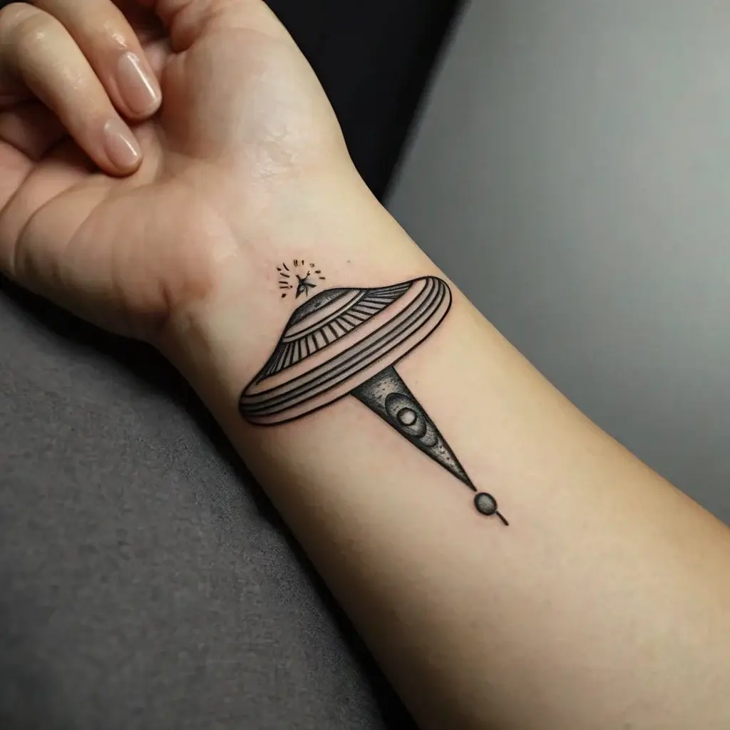 Minimalist UFO tattoo, shaded with dotwork, beams a light illuminating a tiny scene, symbolizing exploration and mystery.