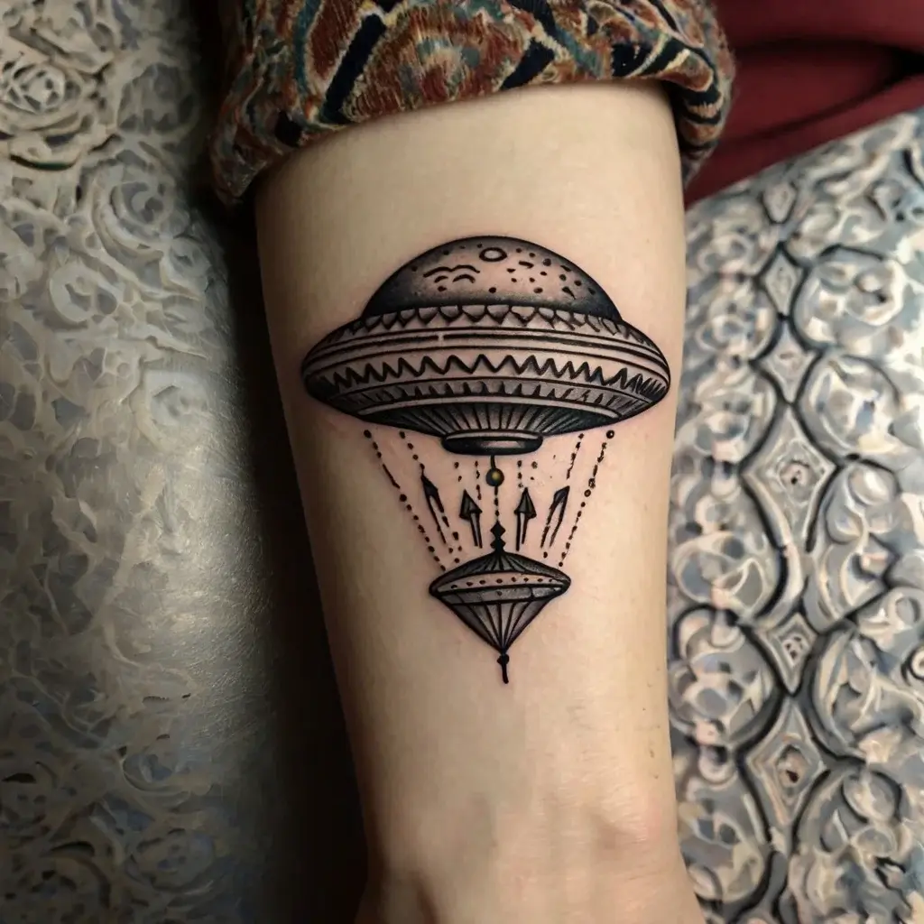 Geometric UFO tattoo with detailed patterns, symmetrical beams, and fine dotwork, creating a mysterious, cosmic vibe.