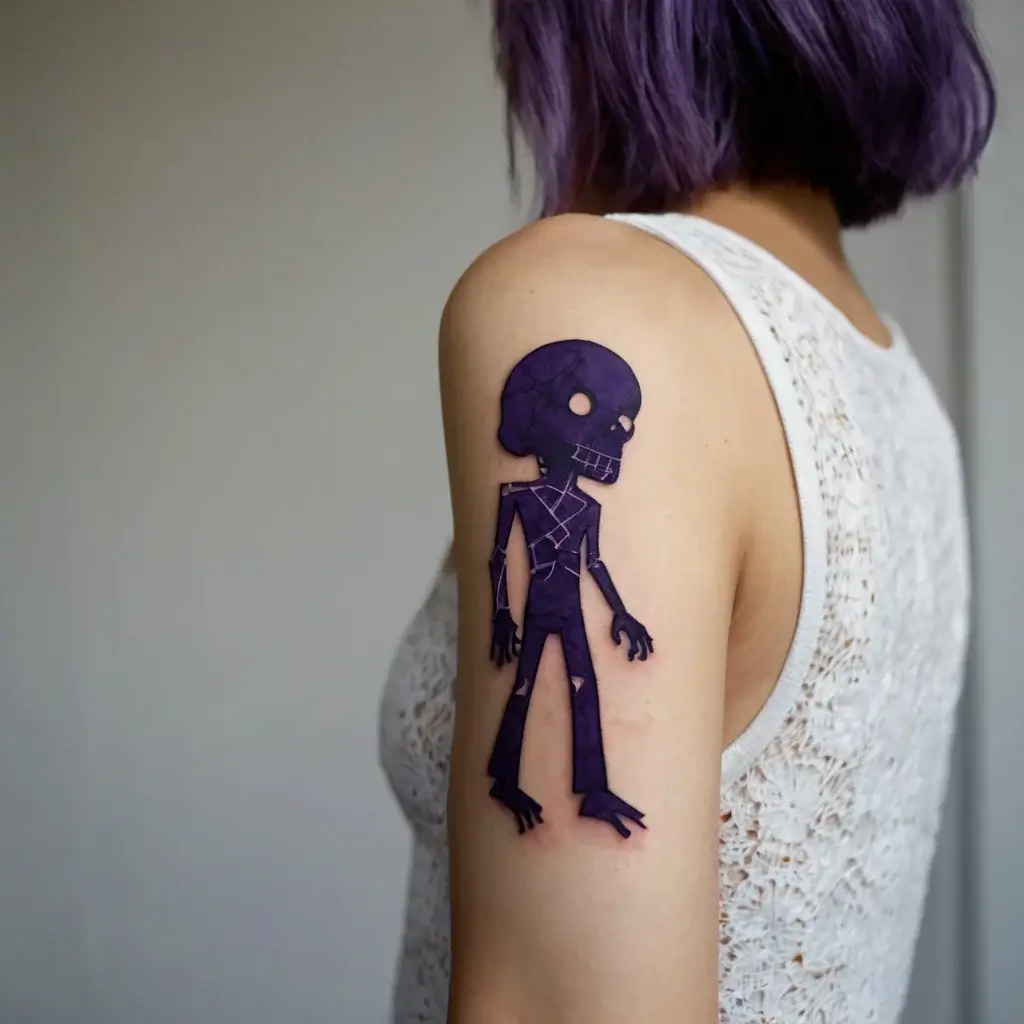 Tattoo of a purple stylized skeleton figure, featuring geometric shapes and patterns, on the upper arm.