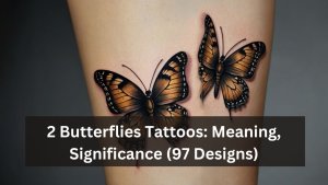 Realistic tattoo of two orange butterflies with black-edged wings, symbolizing transformation and freedom.