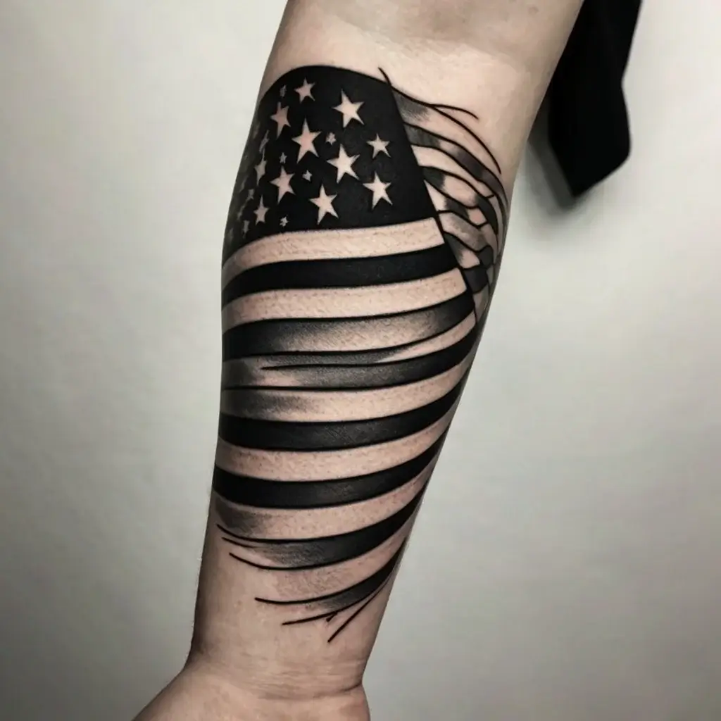 Forearm tattoo of a stylized American flag with bold black stripes and stars, appearing to wave with dynamic energy.