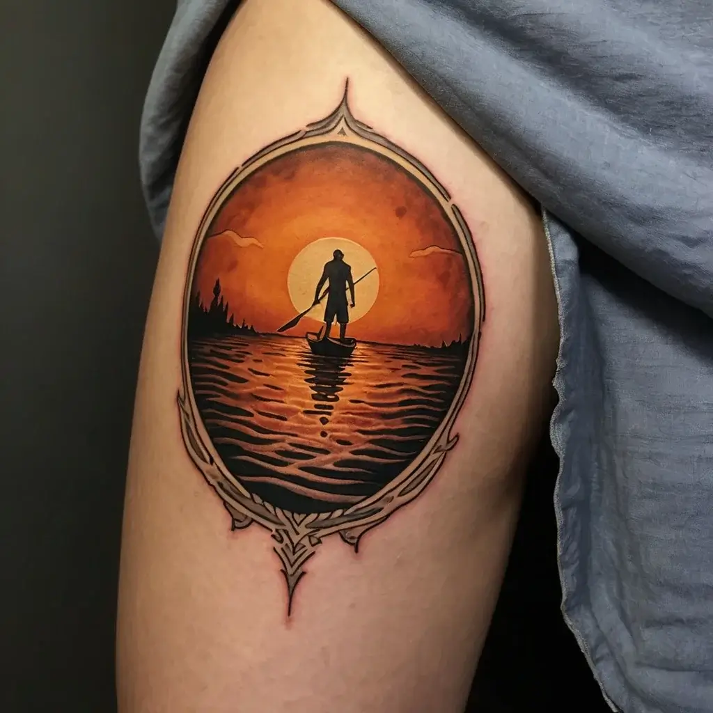 Tattoo of a silhouetted paddleboarder against an orange sunset with a decorative border, reflecting on the water.