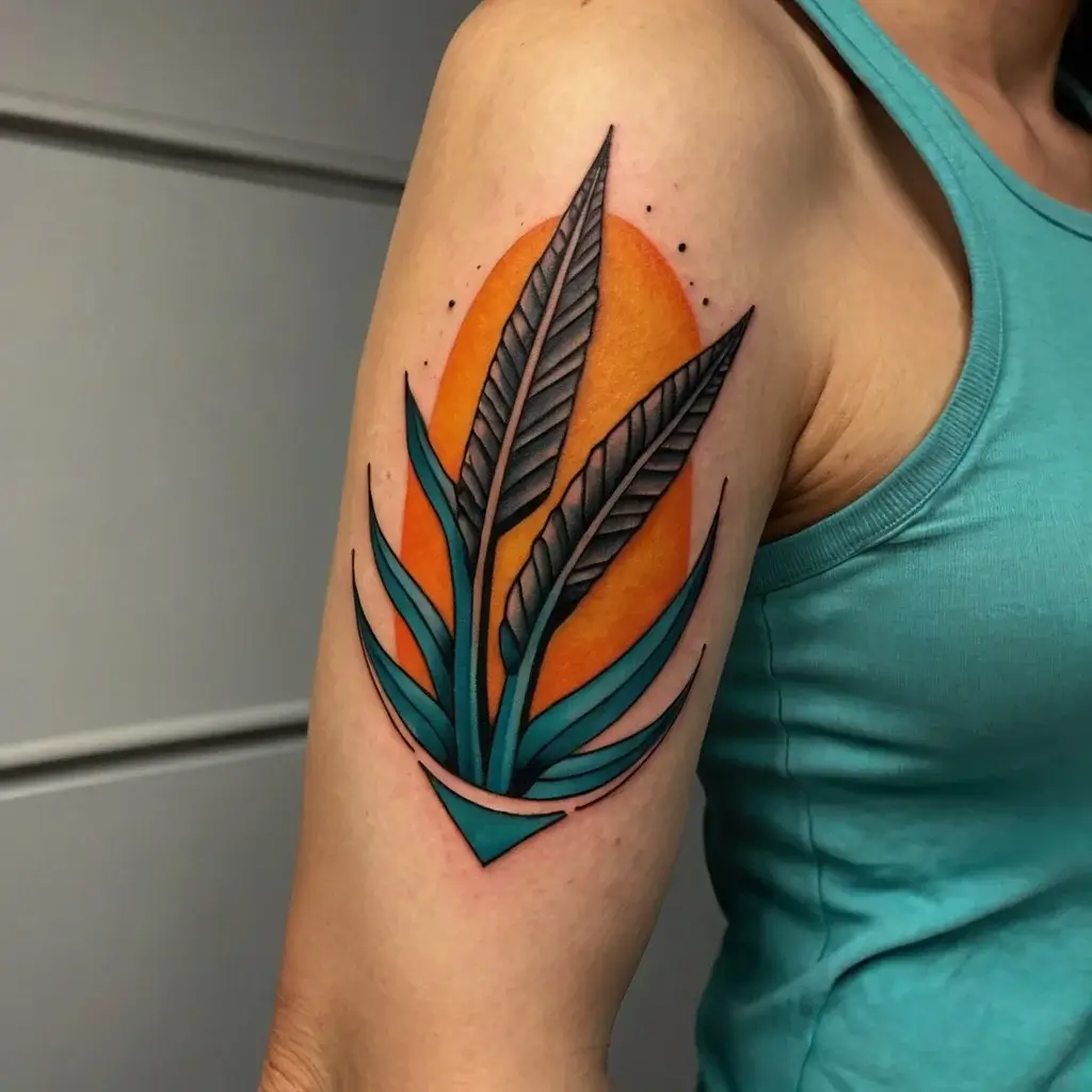 Tattoo of stylized teal and black leaves against an orange circle, with bold outlines and geometric accents.