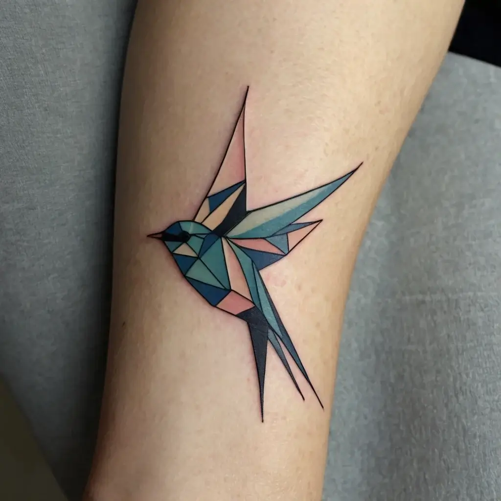 Geometric abstraction of a swallow in shades of teal, blue, and pink, with sharp angular lines on a forearm.